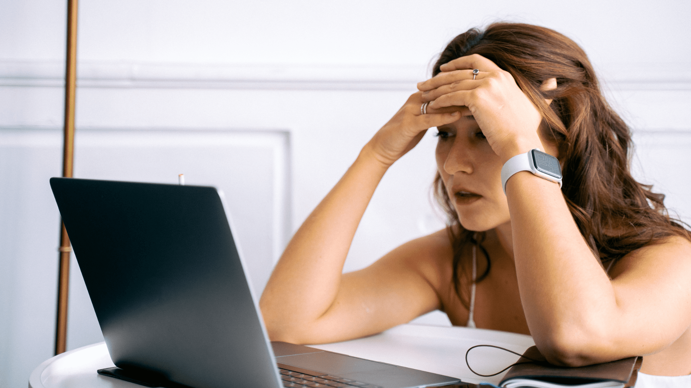 A student holding her head due to Reddit study tips that are wrong.